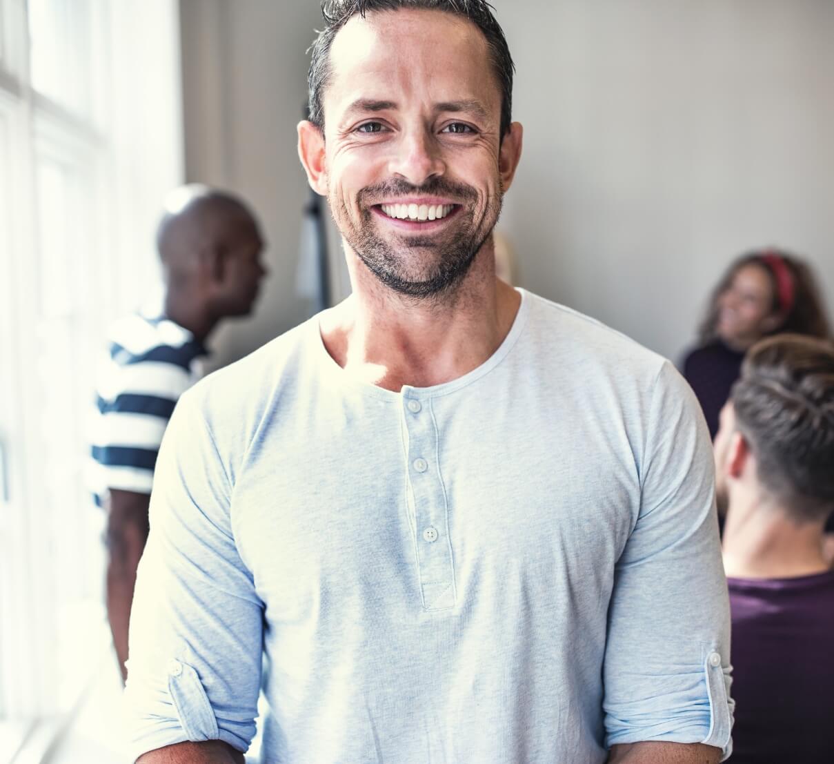 designer-smiling-while-standing-in-a-bright-office-2023-11-27-05-05-27-utc (1)