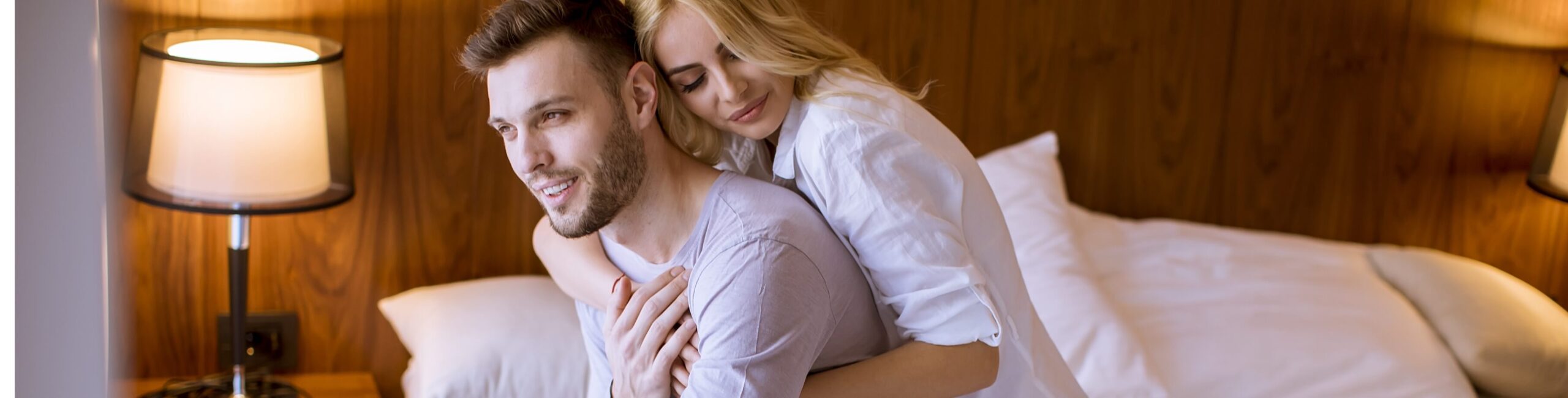 lovely-couple-hugging-on-their-bed-at-home-2023-11-27-05-35-08-utc (1)