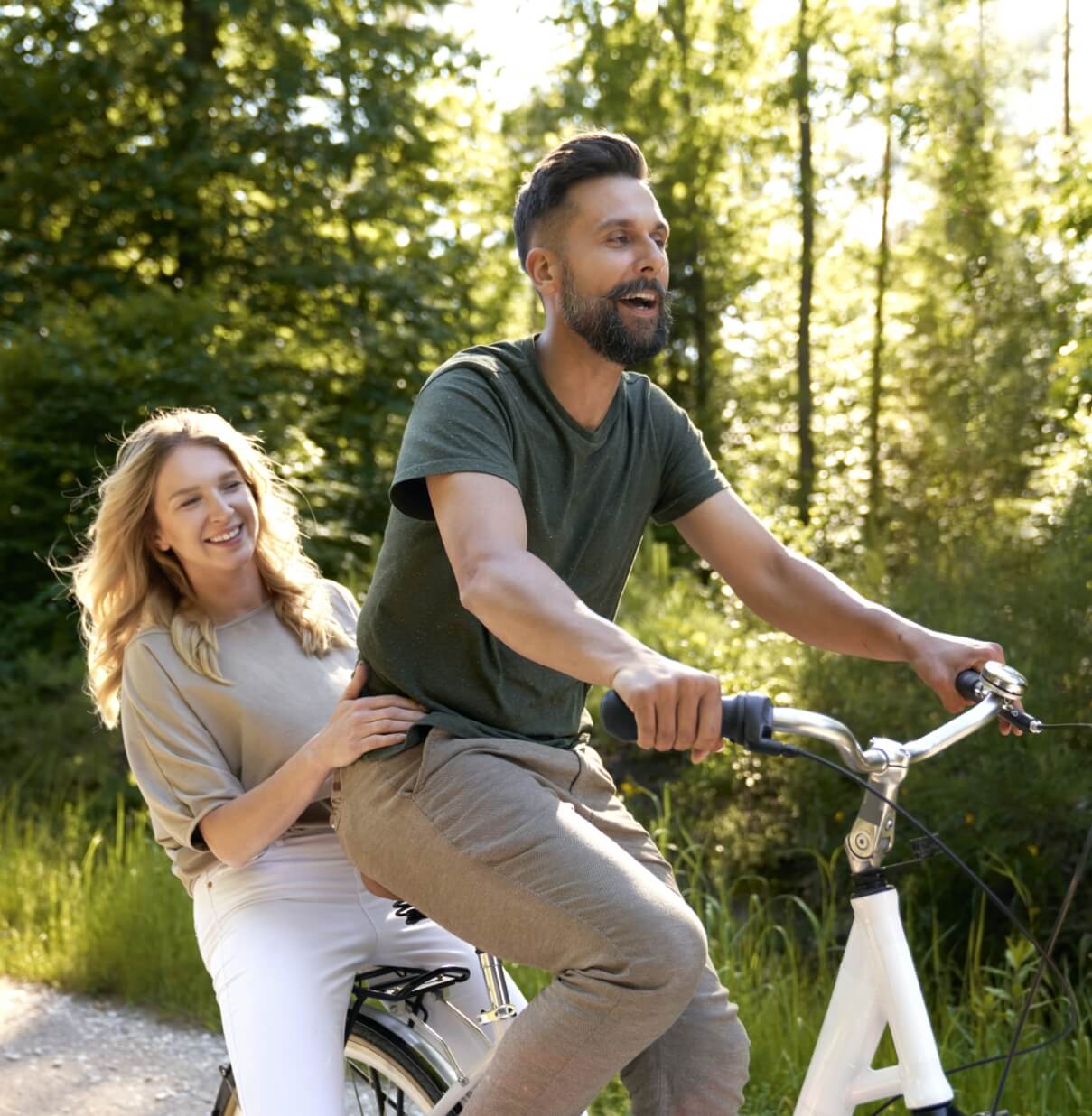 playful-couple-having-fun-on-a-bike-in-the-woods-2024-12-03-21-42-41-utc (1)